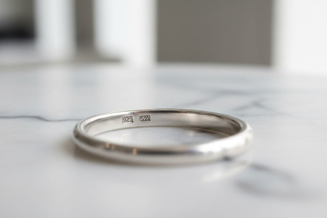 Close-up of 925 hallmark stamp on a sterling silver ring — authentic 925 sterling silver jewelry by LIBREAILE