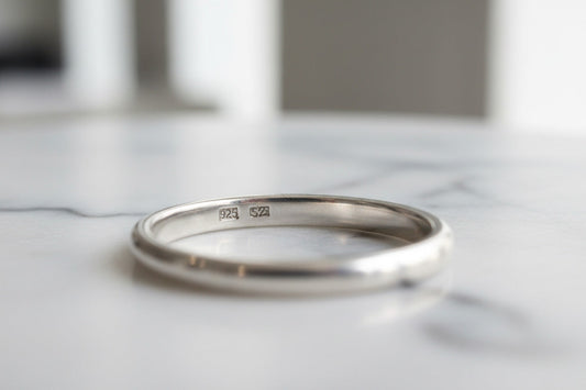 Close-up of 925 hallmark stamp on a sterling silver ring — authentic 925 sterling silver jewelry by LIBREAILE