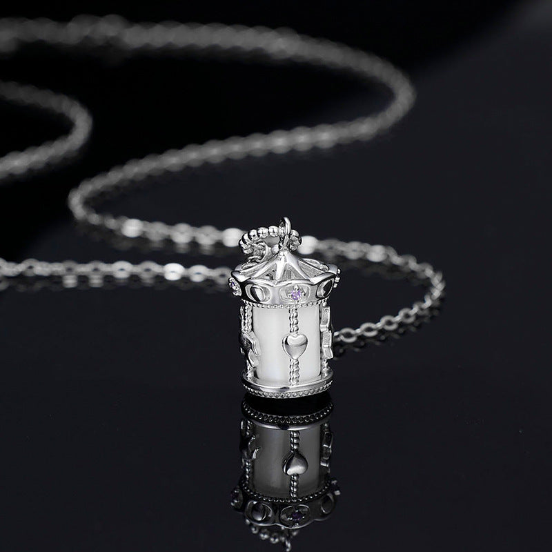 Carousel pendant necklace worn on model, whimsical silver jewelry