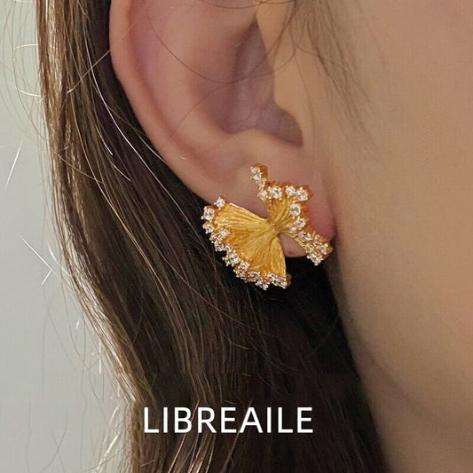 Knotted petal stud earrings worn on model, new season jewelry