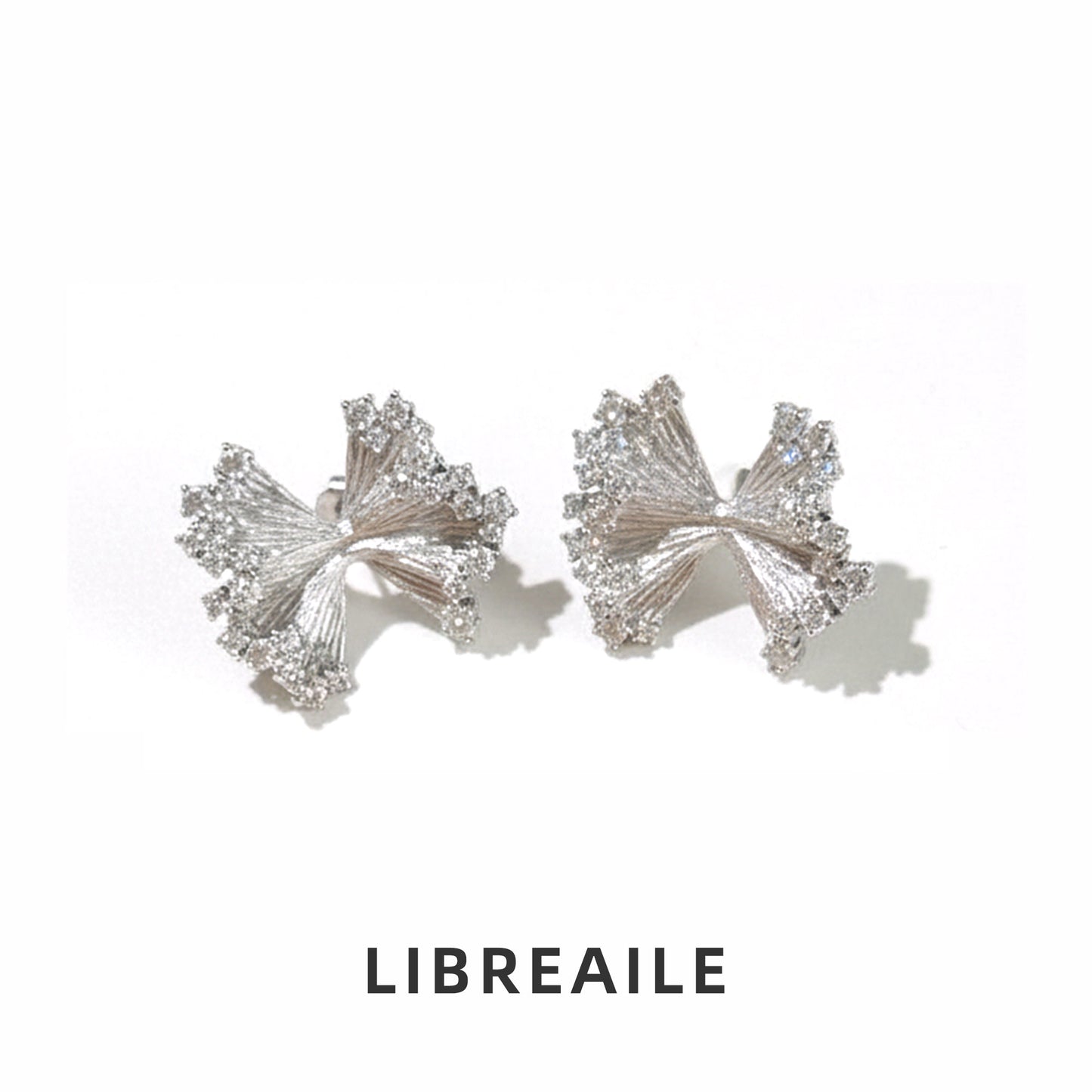 925 silver petal studs close-up, sculptural knotted design